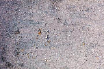 A wall with a lot of scratches and marks on it