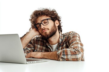 A man with glasses is sleeping on a laptop