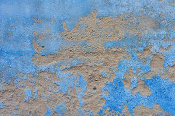 Abstract blue painted wall with eroded texture