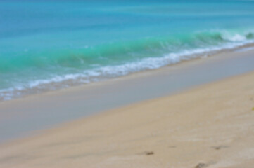 Blurred gradient of sea water and sand beach