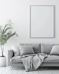 A minimalist living room with a gray sofa. a plant. and a blank square frame on the wall