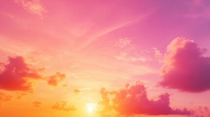 Fototapeta premium Vibrant orange and pink sky at dusk following sunset