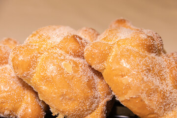 A close-up image of Pan de Muerto (bread of the dead) sold at a shop. Pan de Muerto is a traditional Mexican sweet bread, made for Día de los Muertos.