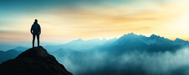 Adventurous hiker standing on mountain peak, admiring breathtaking sunrise view over misty valleys, adventure exploration concept