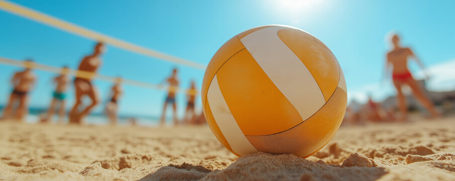 Volleyball on sandy beach with players in background, blue sky, summer sport, bright sunny day outdoor game activity, fun recreation, vacation joy concept