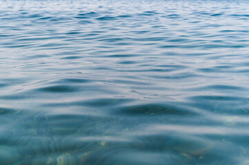 Sea surface with waves. Abstract background of water flow in ocean, sea, river, lake. Seascape wallpaper.