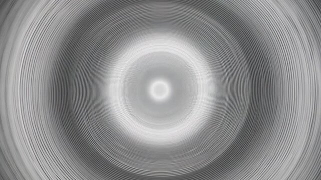 Gray concentric circles shrinking towards a bright center