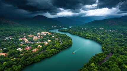 Fototapeta premium A stunning aerial view of lush green river valley under dramatic stormy skies