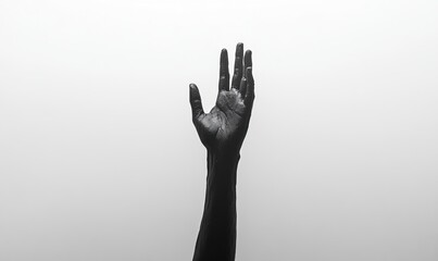 A monochrome image featuring a black hand reaching upwards against a minimalistic white background, symbolizing hope and longing