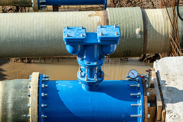 New fiber glass water pipeline in trench. Replacement of old rusty tubes by new one