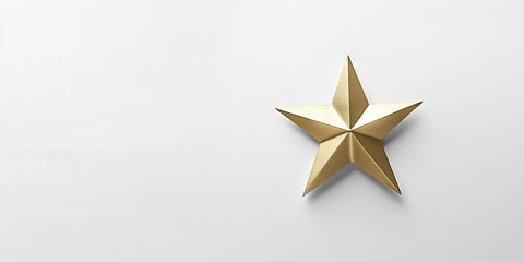 Obraz premium A gold star is on a white background. The star is the focal point of the image and is surrounded by a lot of white space. Concept of achievement and success
