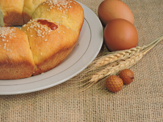 Bluder or sweet bread which is a mixture of bread and cake dough has a soft texture, sprinkled with toasted sesame seeds on top, enjoyed in the afternoon or morning as a snack