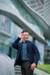 Fototapeta premium person, business, businessman, adult, man, male, happy, lifestyle, portrait, success, confident, professional, handsome, cheerful, corporate, city, young, caucasian, manager, one, smile, suit, backgro