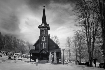 view wooden church in Tatranska Javorina in winter