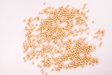 Chickpeas, raw and uncooked. Chickpea or garbanzo bean background. Full body photo of dry yellow colored shelled garbanzo beans. Close up view of chickpeas for cooking or health food concept