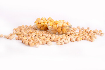 A bowl of chickpeas is on a white table