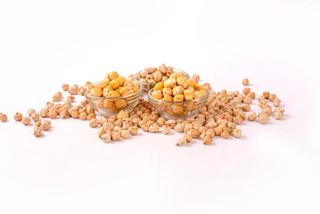 A bowl of chickpeas is on a white table