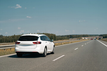 Wagon car cruising down an empty highway