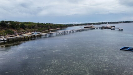 view of the beach with long bridge