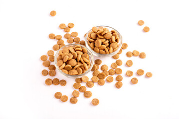Top view of crunchy brown bone shaped dog biscuit as a treat set isolated on white background close up