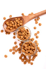 Top view of crunchy brown bone shaped dog biscuit as a treat set isolated on white background close up