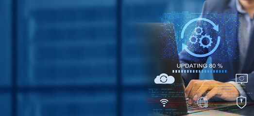A business person updates software, installs an update process, and upgrades the software version...
