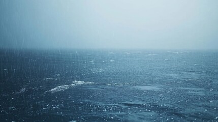 Fototapeta premium Rain Falling on the Surface of the Ocean