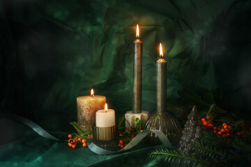 Fourth Advent with four lit candles, fir twigs, red orange berries and Christmas decoration, dark...
