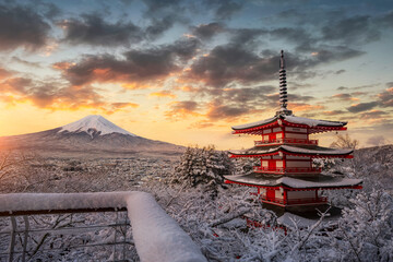 Fujiyoshida, Japan Beautiful view of mountain Fuji and Chureito pagoda at sunrise of Mount Fuji during winter.This is one of the famous spot to take pictures of Mount Fuji.