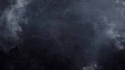 Dark grunge texture with a black background resembling a chalkboard or concrete wallpaper
