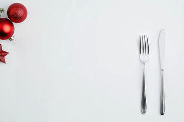 Festive place setting with Christmas ornaments and cutlery
