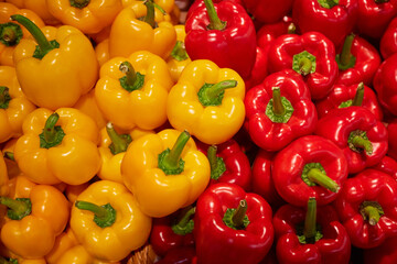 Red and yellow bell peppers in a market, Close-up of colorful bell peppers