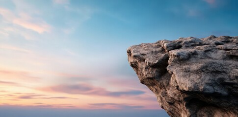 Remote steep rocky cliff with a dramatic overhang, showcasing nature's rugged beauty and breathtaking landscapes.