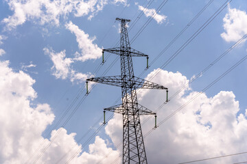 High voltage towers with sky background. Power line support with wires for electricity...