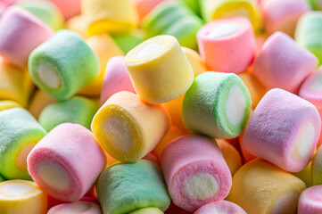 A colorful assortment of pastel-hued marshmallows, showcasing a variety of soft textures and hues.