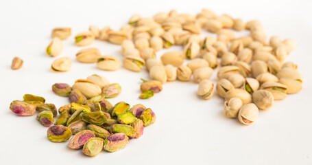 Roasted pistachios on white background