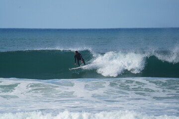 surfing sports in the waves in portugal during the winter season 