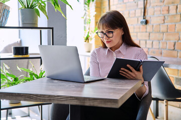 Woman psychologist mental therapist working remotely using computer for online therapy