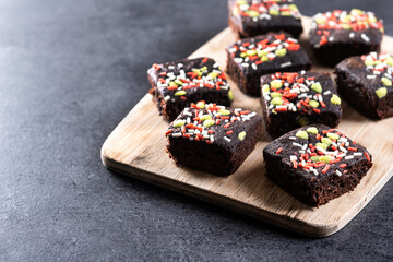 Christmas brownie on black background. Copy space