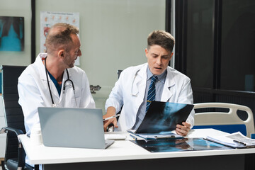 Medical team working on digital tablet healthcare doctor technology tablet using x-ray film analyzed the results of medical reports.