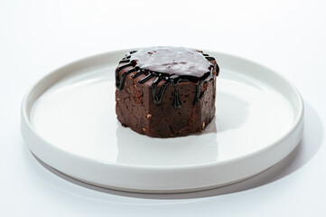 cakes with berries, chocolate and nuts on a white background