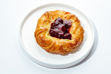 cakes with berries, chocolate and nuts on a white background
