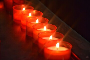 Candles are lit in the church in memory of the deceased.