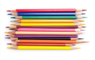Obraz premium Vibrant pencils and paintbrushes in assorted colors, neatly arranged on white, top-down view, art supply concept