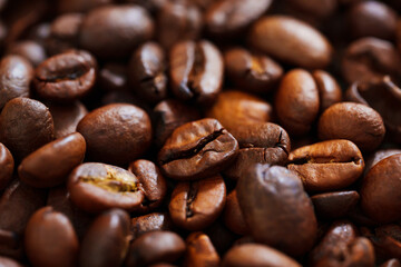 background. roasted beans of natural coffee. raw materials for coffee shops, coffee machines.