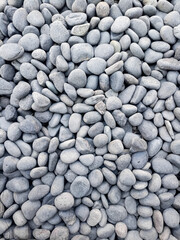 Small grey stones in close-up background texture,spa concept