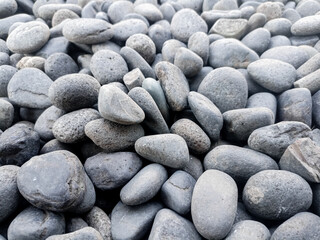 Small grey stones in close-up background texture,spa concept