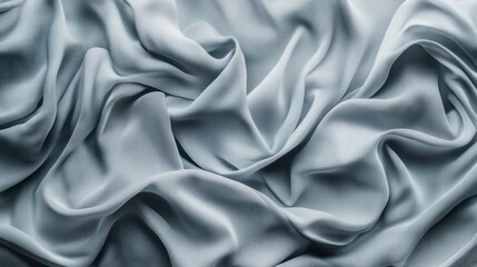 Obraz premium Wrinkled fabric texture in cool gray tones, forming a subtle, organic pattern