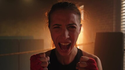 Outcry independent girl power. Angry strong crazy woman fighter screaming looking aggressive on boxing ring. Powerful ambitious victorious confident successful girl champion emotional energetic