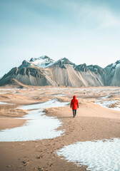 Solitary winter hike in breathtaking mountain landscape for nature and adventure themes